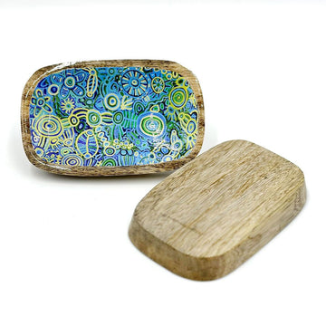 Two wooden trinket trays pictured showing the front and back. The front is printed with artwork by Cedric Varcoe and the back is plain wood.