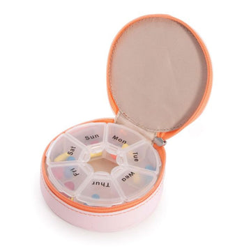 Three round cases with zipper closures in peach, mint green and purple.