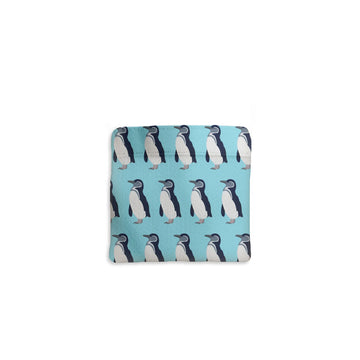 Tote bag with penguin pattern on a light blue background.