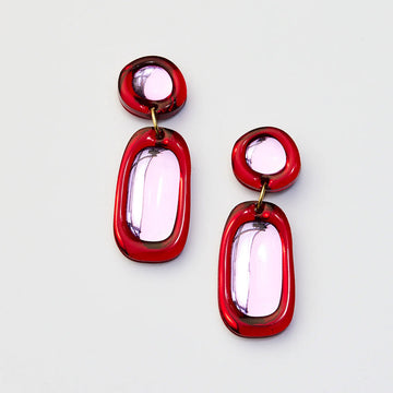 A pair of drop earrings in red and pink.