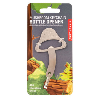 A mushroom shaped bottle opener in metal attached to a card.