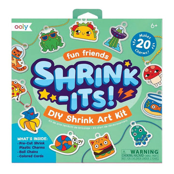 Shrink-Its DIY Shrink Art Kit packaging with colorful shrink charms on a green background.
