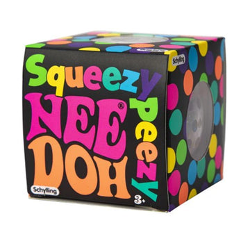 A stress ball inside a cube box with the text 'Squeezy Peezy Nee Doh' written on the front.