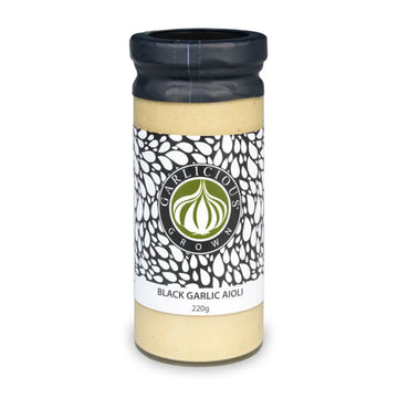 A cylinder jar with a wide product label and the heading 'Black Garlic Aioli'.