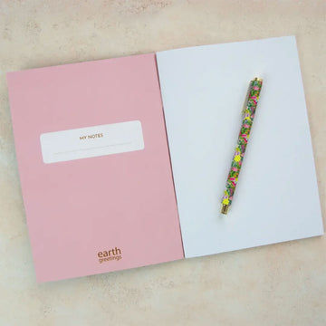 Floral notebook with 'earth greetings' branding on a white background.