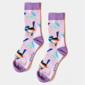 A pair of light purple socks with a purple heel, toe and cuff illustrated with fairy wrens.