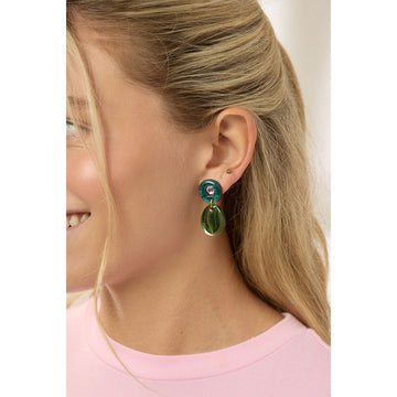 Green and pink earrings on a light gray background.