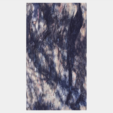 Marbled black and white stone scarf on a light gray background.