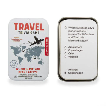A trivia card game in a tin titled 'Travel Trivia Game' with a map of the world and planes flying around it. There is an example of a card next to the box.