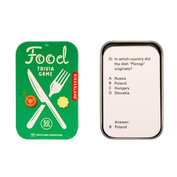 A trivia card game in a green tin case titled 'Food Trivia Game' with an illustration of a knife and fork. There is an example card next to the tin.