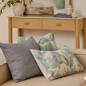 A white and blue floral rectangle cushion.