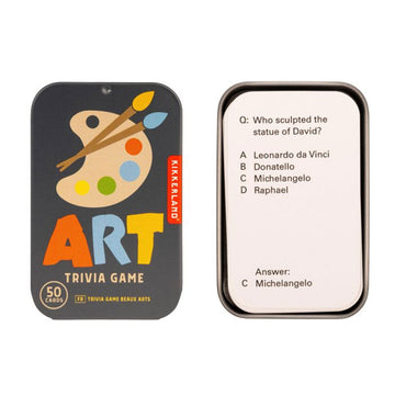 A trivia card game in a tin box titled 'Art Trivia Game' with an illustration of paint and paint brushes. There is an example cart next to the tin.