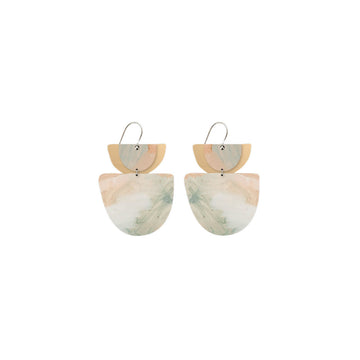 A pair of drop earrings with a large bell shape and two layers linked together printed with artwork by Kiasmin.