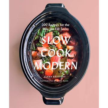 'Slow Cook Modern' book cover featuring a top down view of a slow cooker filled with vegetables.