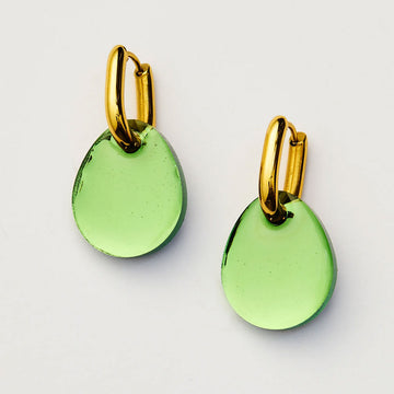 Green earrings with gold hooks on a light gray background.