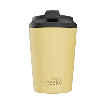 A ceramic reusable coffee cup in lemon yellow with a black lid.