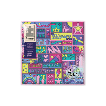 A box with an abstract grid design with pop star symbols and names of singers including 'Britney', 'Ariana' and 'Elton'.