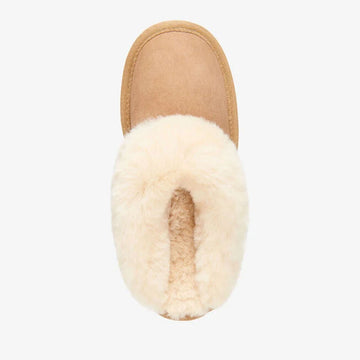 Light brown slipper with sheepskin lining on a white background.