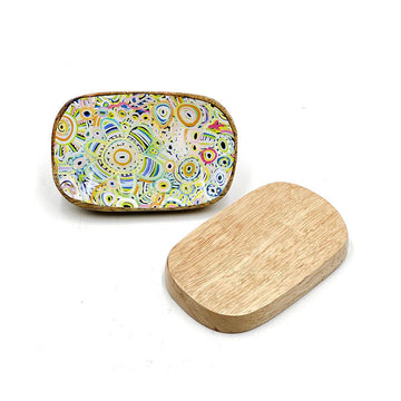 A wooden trinket dish printed with artwork by Cedric Varcoe on the inside and wood on the back.