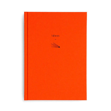 Front cover of an orange journal with the small heading 'Ideas' and a line drawing of a shooting star.
