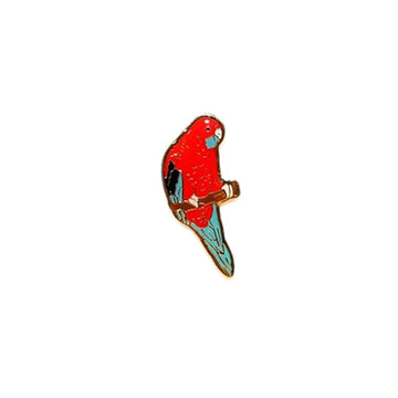 An enamel badge in the shape of a crimson rosella.
