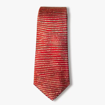 A red tie with cream coloured dots in horizontal lines.