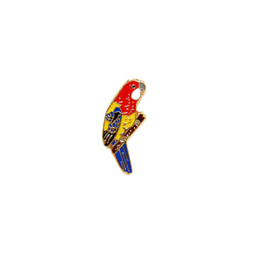 An enamel badge in the shape of an eastern rosella.