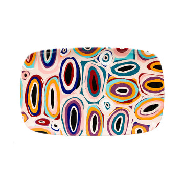 Colorful abstract patterned ceramic tray on a white background.
