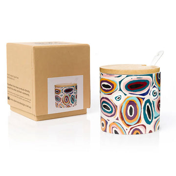 Colorful patterned sugar bowl with wooden lid and matching box on a white background.