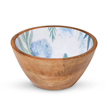A wooden bowl printed with blue flowers on the inside.