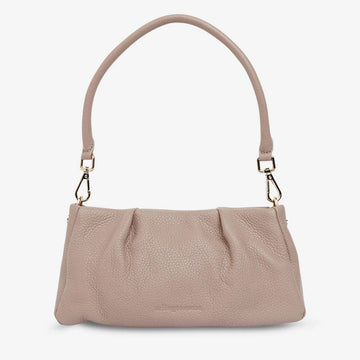 A leather handbag in a fawn colour with two tucks at the top.