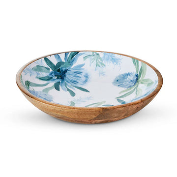 A wooden salad bowl printed with blue flowers on the inside.