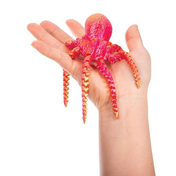 A display of 3D printed sea creatures in different colours in clear cube boxes.