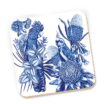 A cork coaster illustrated with birds and flowers in blue and white.