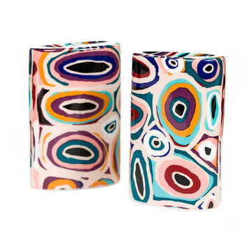 Two colorful ceramic salt and pepper shakers with abstract pattern on a white background.