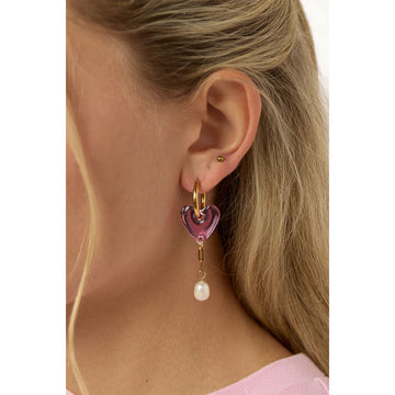 Heart-shaped earrings with pink hearts and pearl drops on a light gray background.