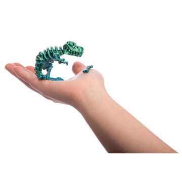 A set of 3D printed dinosaur toys in clear cube boxes.