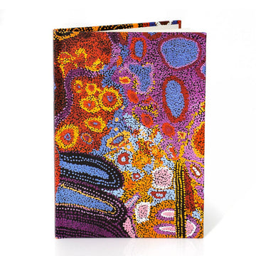 Colorful abstract design notebook on a white background.