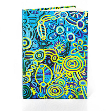 Colorful abstract design notebook on a white background.