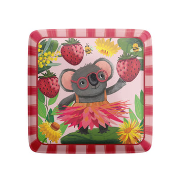 A square magnet illustrated with a koala wearing a pink grass skirt surrounded by strawberries and flowers.