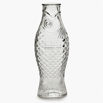 A clear glass carafe shaped like a fish.