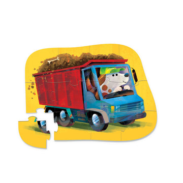 Puzzle box with a colorful illustration of a dog driving a truck on a white background.