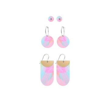 Three pairs of earrings pictured all printed with colourful artwork by Maggi McDonald. There is a pair of small circle studs, a pair of hoop circle earrings and a pair of drop earrings with a tab shape.