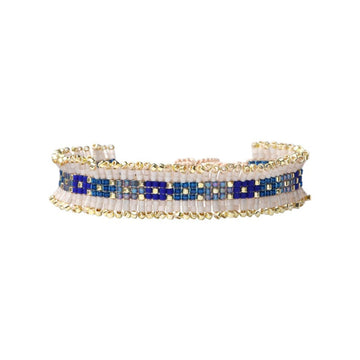 Beaded bracelet with blue and gold accents on a white background.