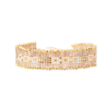 Beaded bracelet with gold accents on a white background.