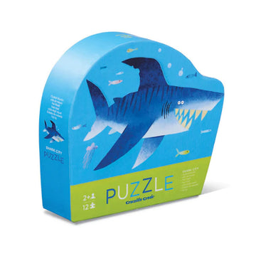 A blue puzzle box with an illustration of a shark on the front.