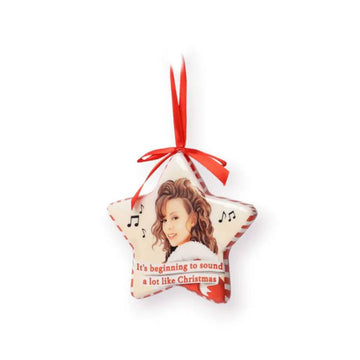 A star shaped Christmas ornament with an illustration of Mariah Carey and the text 'It's beginning to sound a lot like Christmas'.
