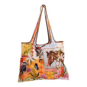 A reusable shopping bag illustrated with a collage of flowers, birds and a cowboy hat.