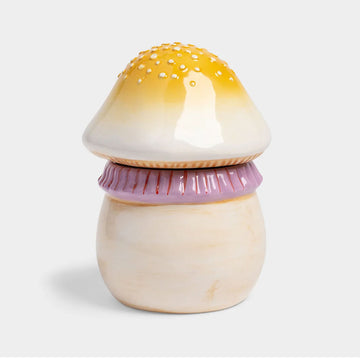 Mushroom-shaped container with a yellow cap and pink detail on a white background.