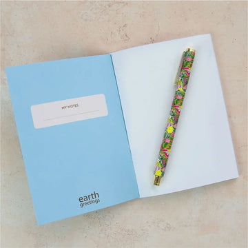 Floral notebook with 'earth greetings' branding on a white background.